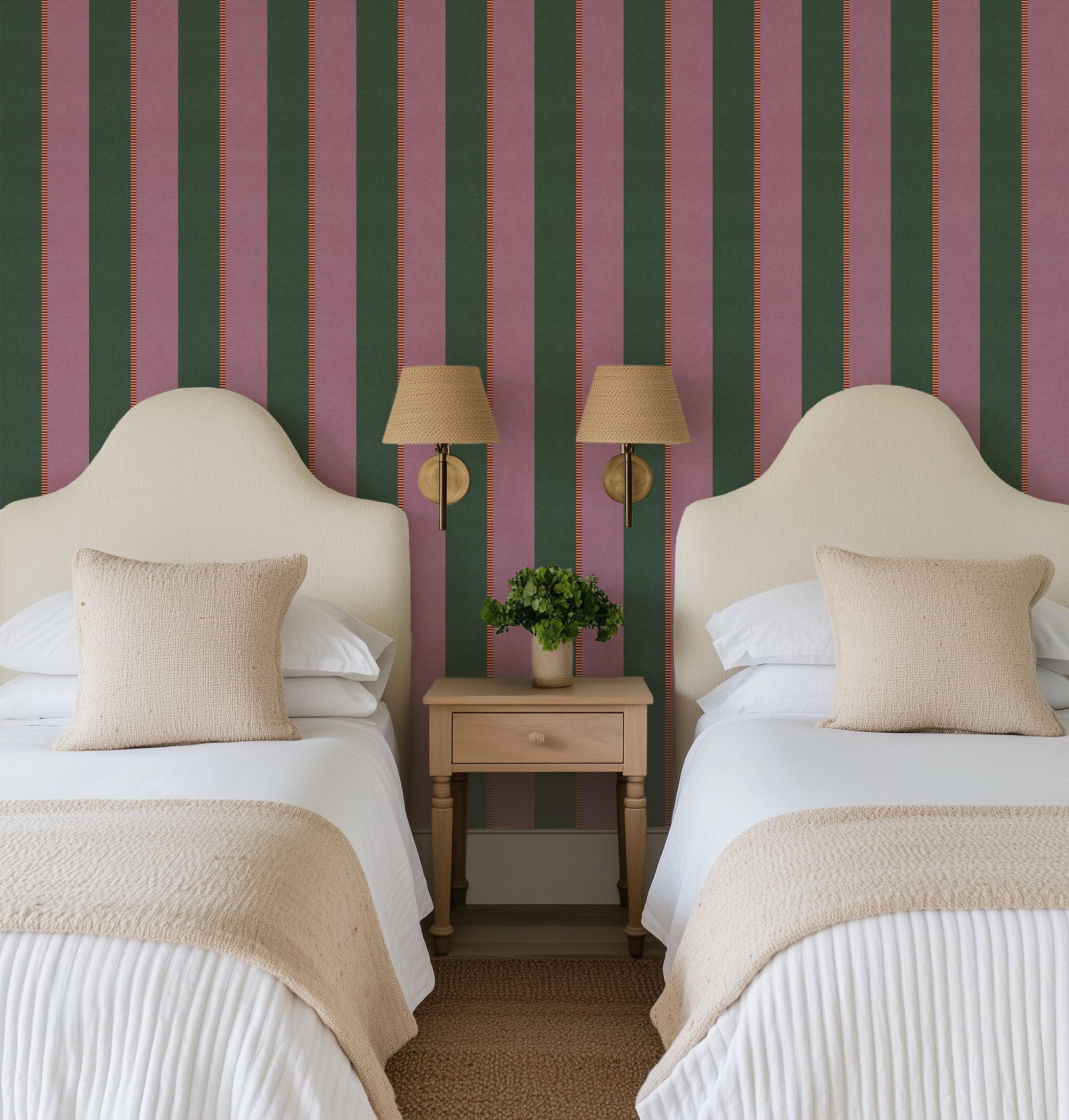Two beds with beige pillows and white bedding against a striped green and pink wall. Vertical stripe wallpaper pattern featuring alternating wide bands with fine accent stripes, creating a tailored, rhythmic design with classic structure and modern polish.
